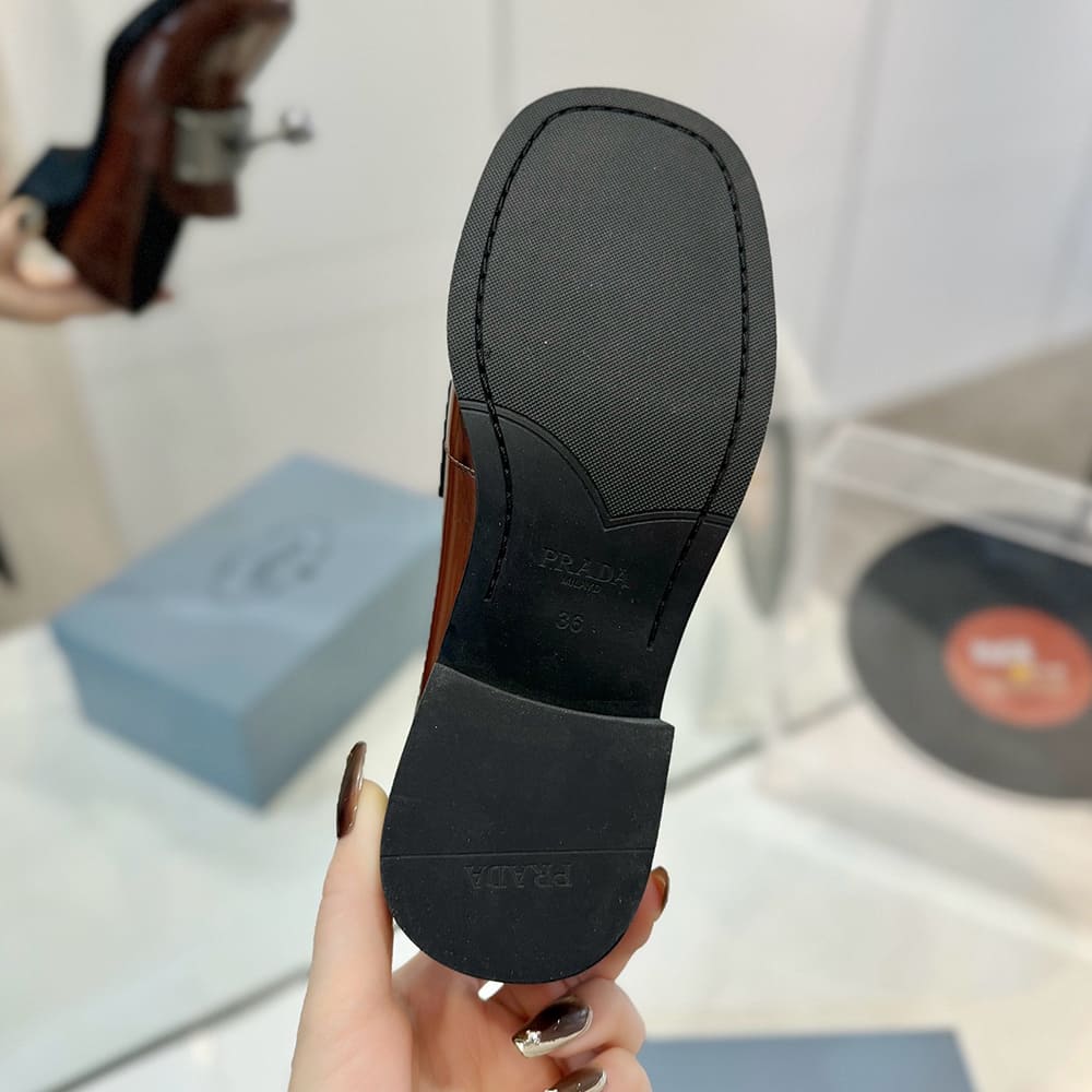 PRADA Brushed leather loafers with metal details